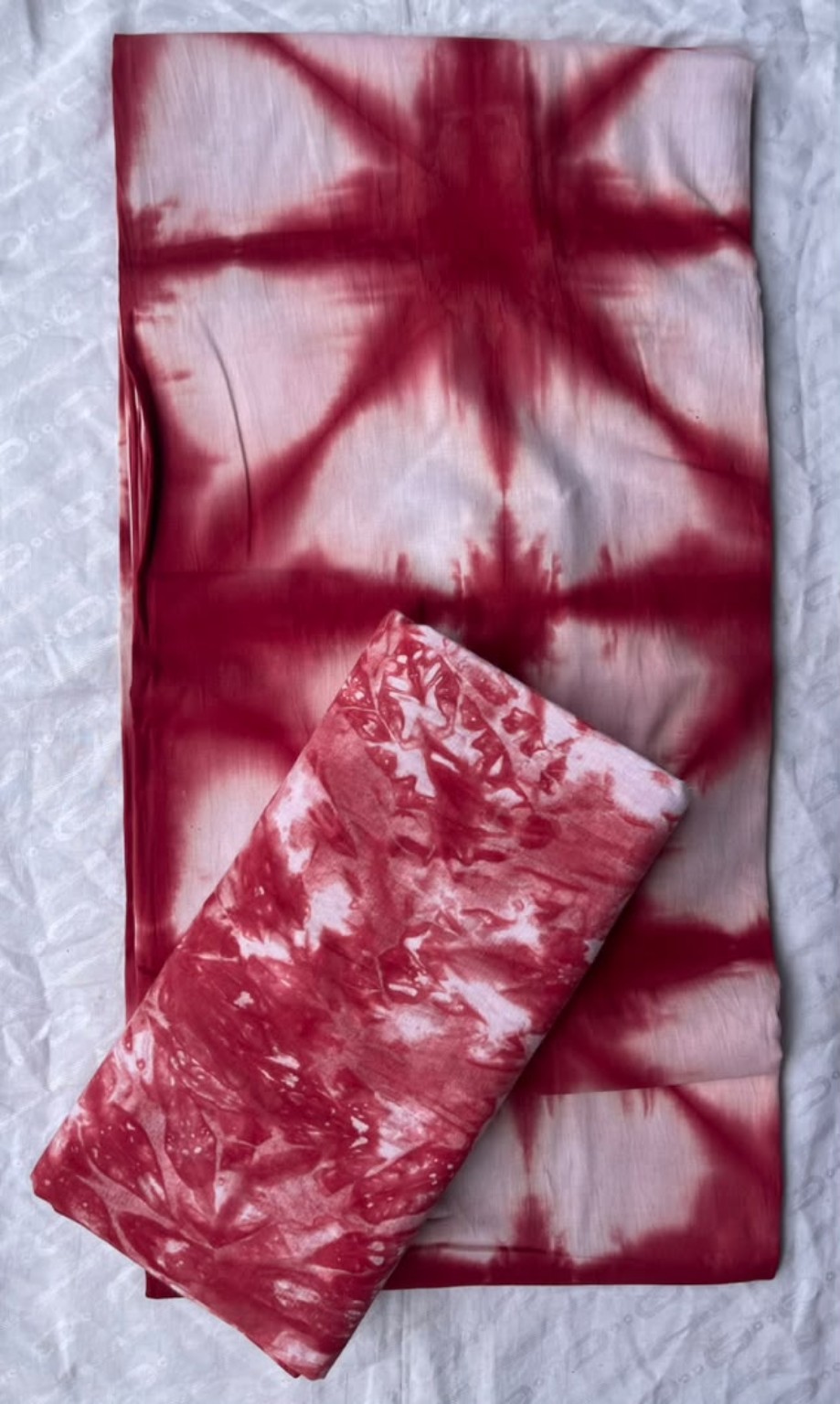 Five-yard crimson red and blush tie-dye fabric with bold starburst and marbled patterns