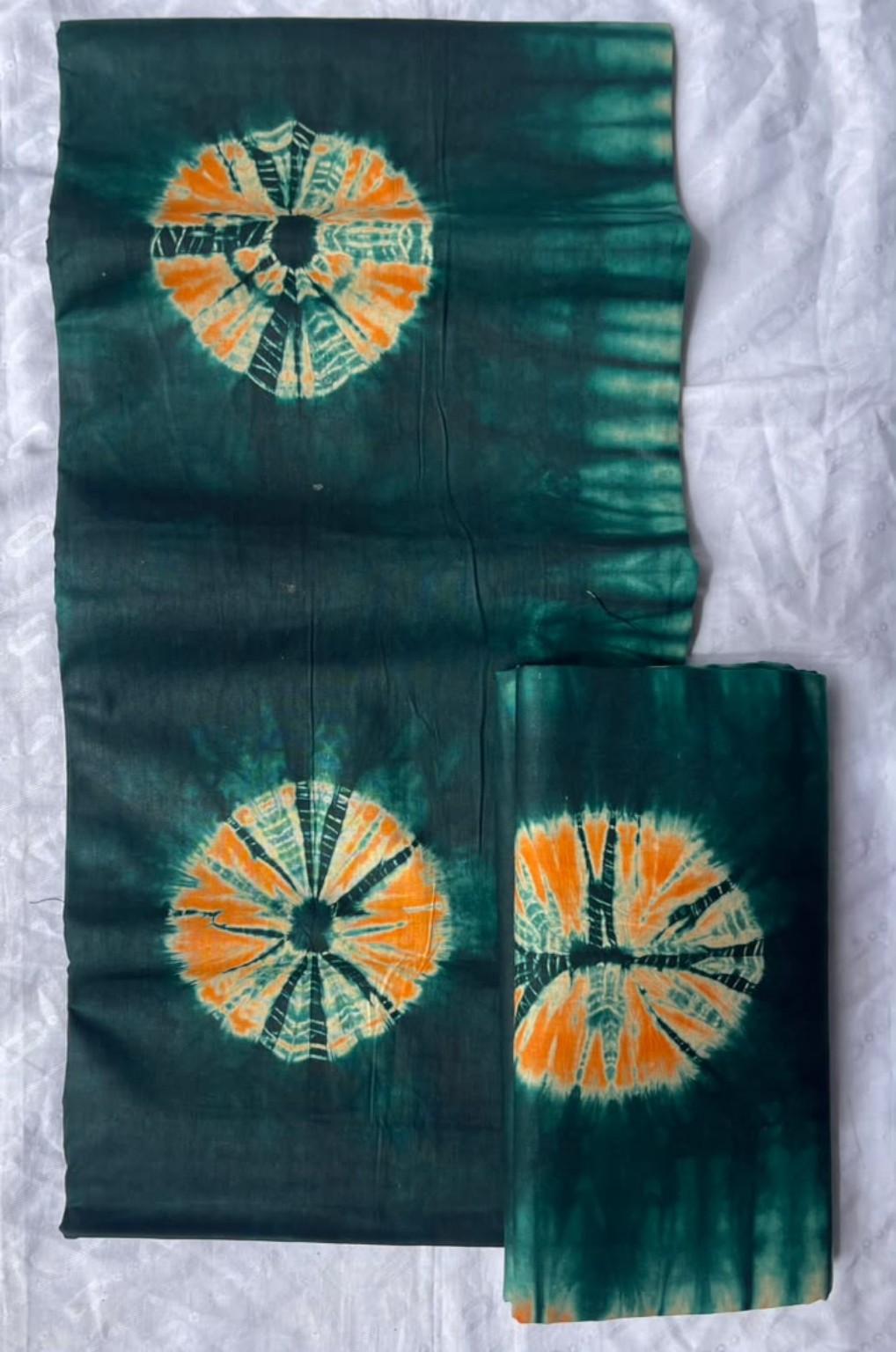 Five-yard deep emerald fabric with orange circular medallion motifs
