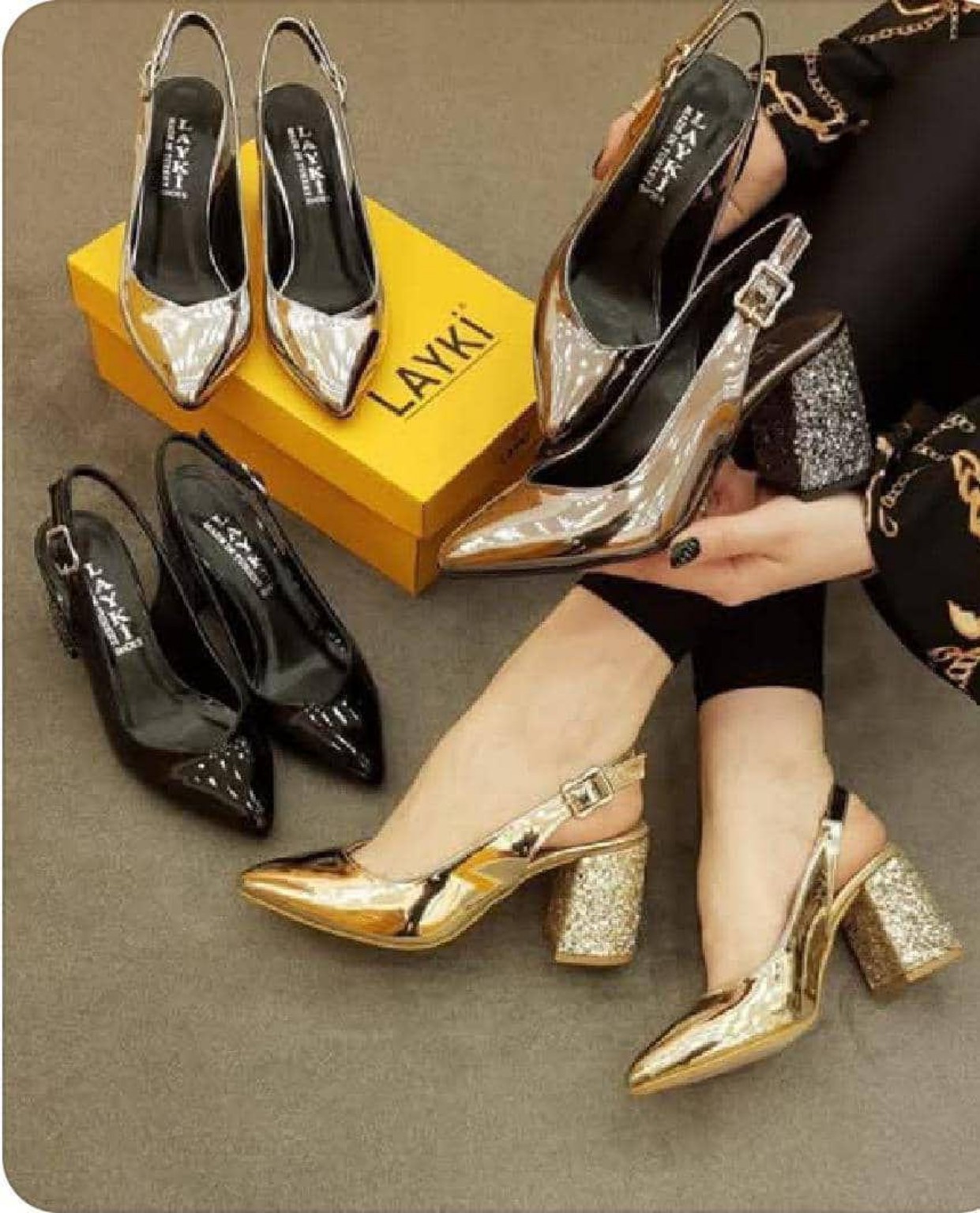 Metallic gold pointed-toe slingback shoes with sparkling rhinestone block heels