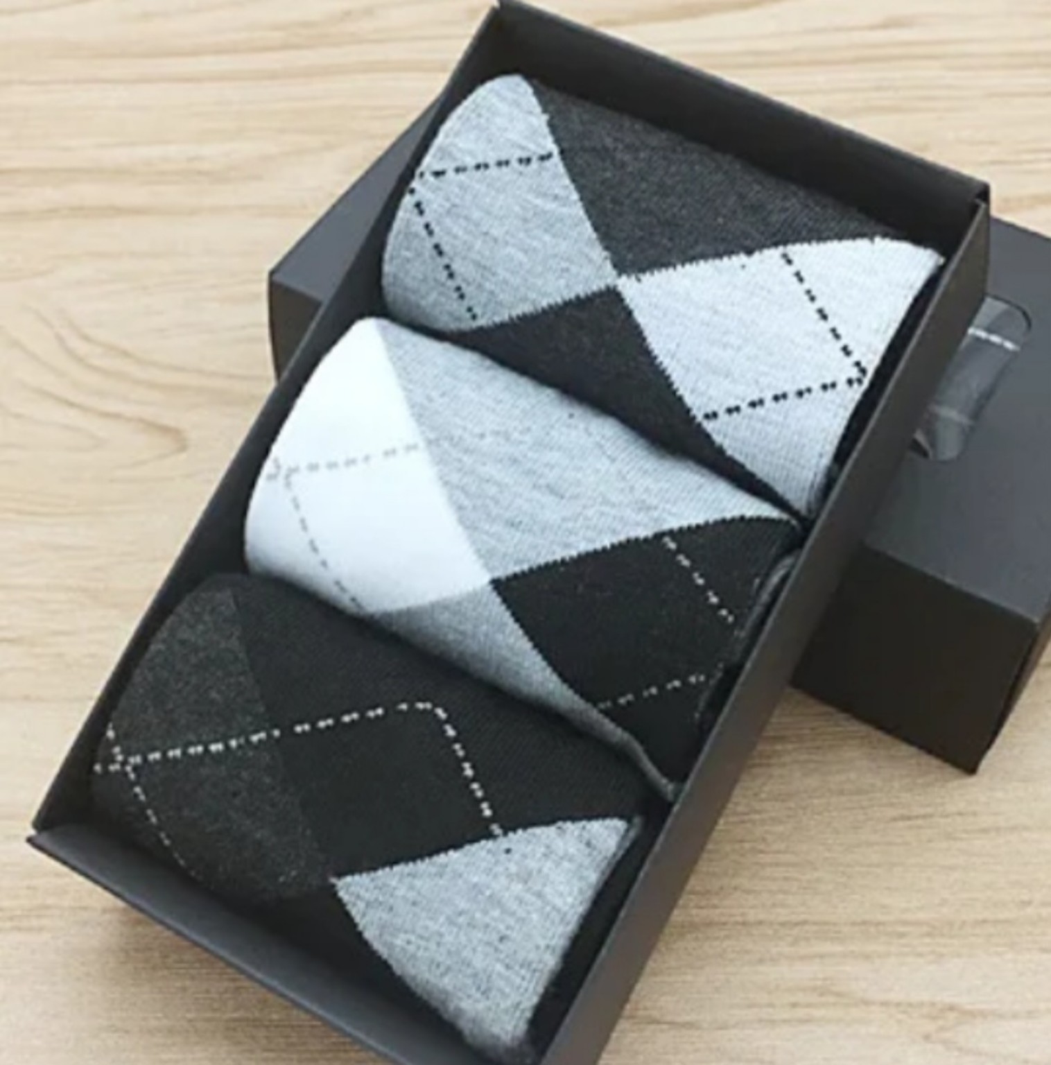 Gift box of men’s cotton socks in black, grey and white argyle designs