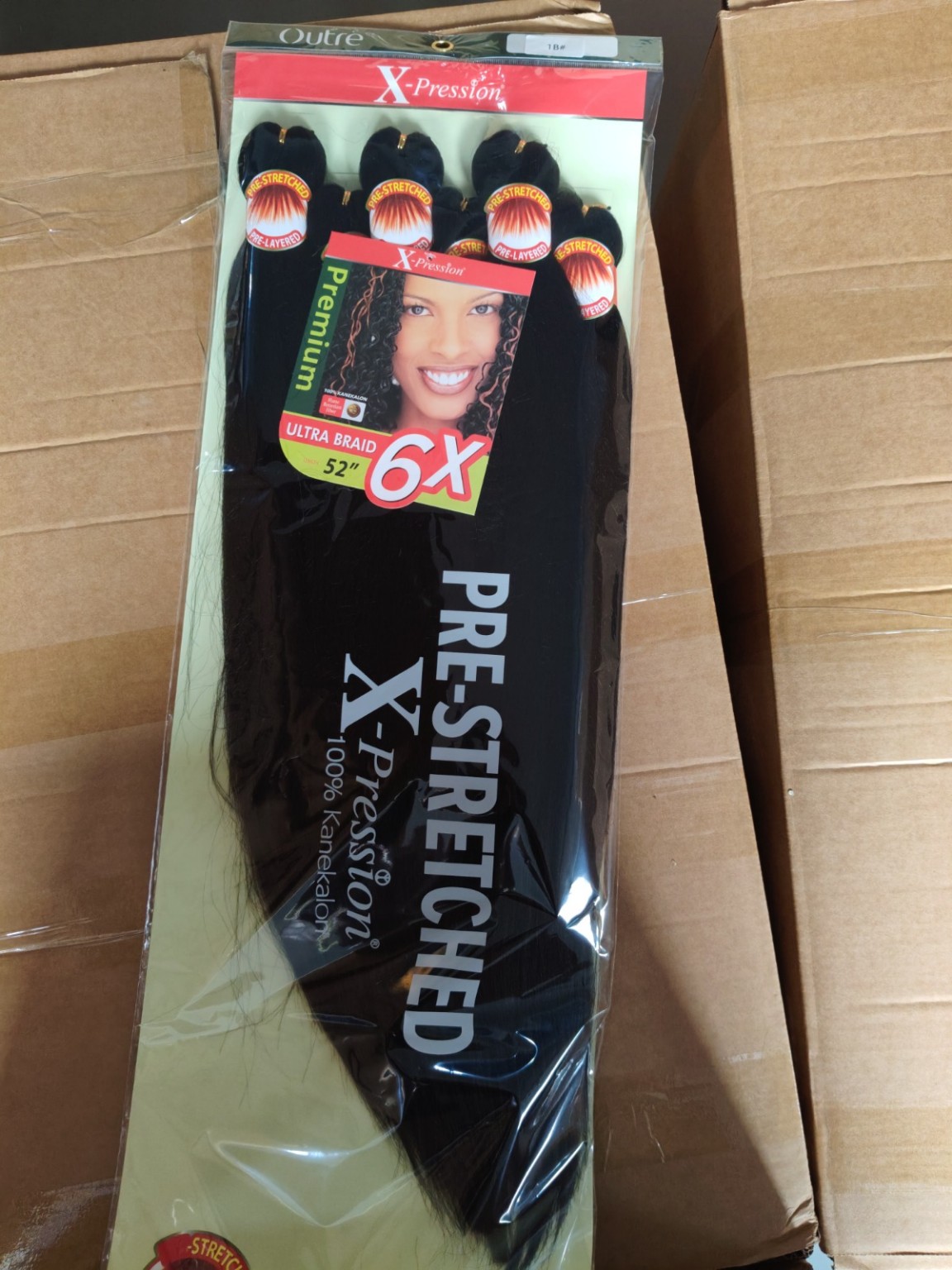 Outre X-Pression 6X pre-stretched ultra braid hair in color 1B Natural Black