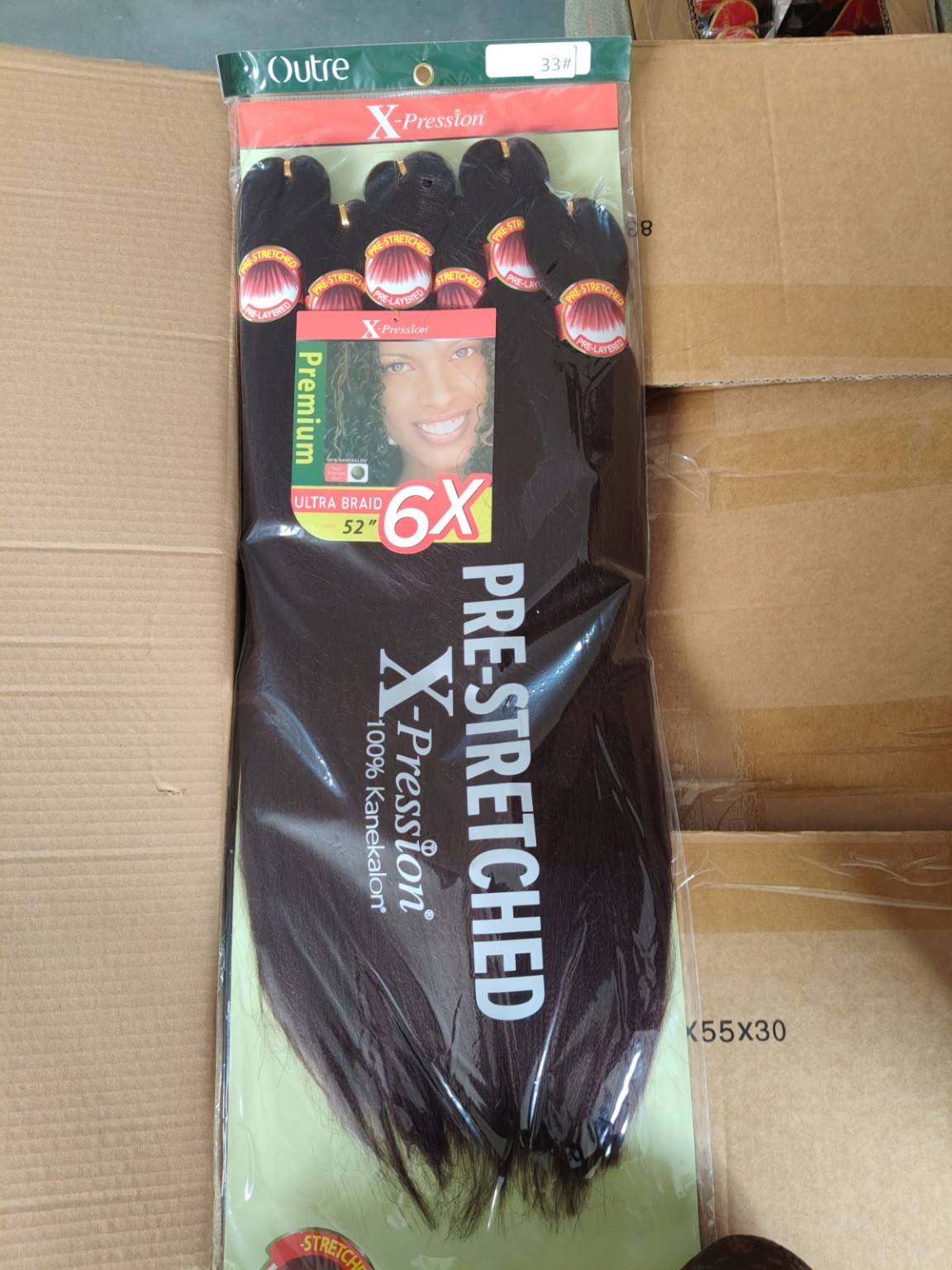 Outre X-Pression 6X pre-stretched ultra braid hair in color 33 Dark Auburn