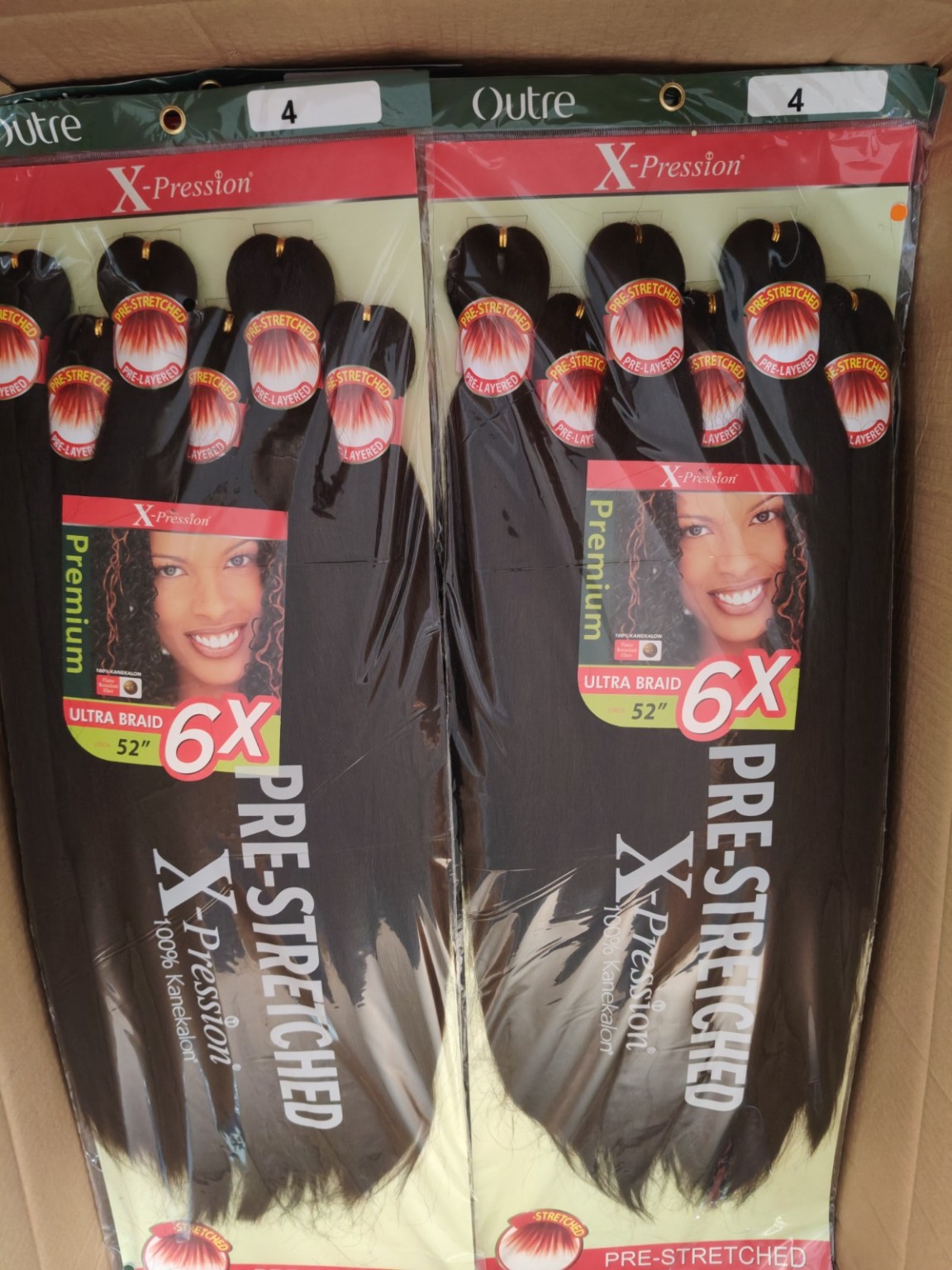 Outre X-Pression 6X pre-stretched ultra braid hair in color 4 Warm Brown